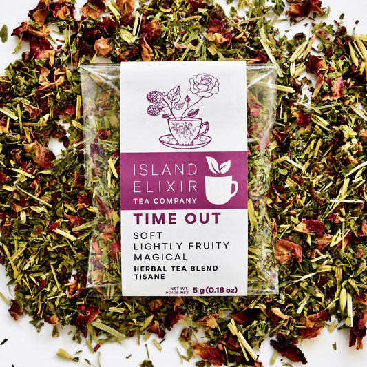 Time Out Herbal Tea 4 cups of tea size compostable packaging sitting on loose tea that contains Raspberry, Alfalfa, Oatstraw, Rose, Rooibos, Nettle, Red clover, Raspberry leaf