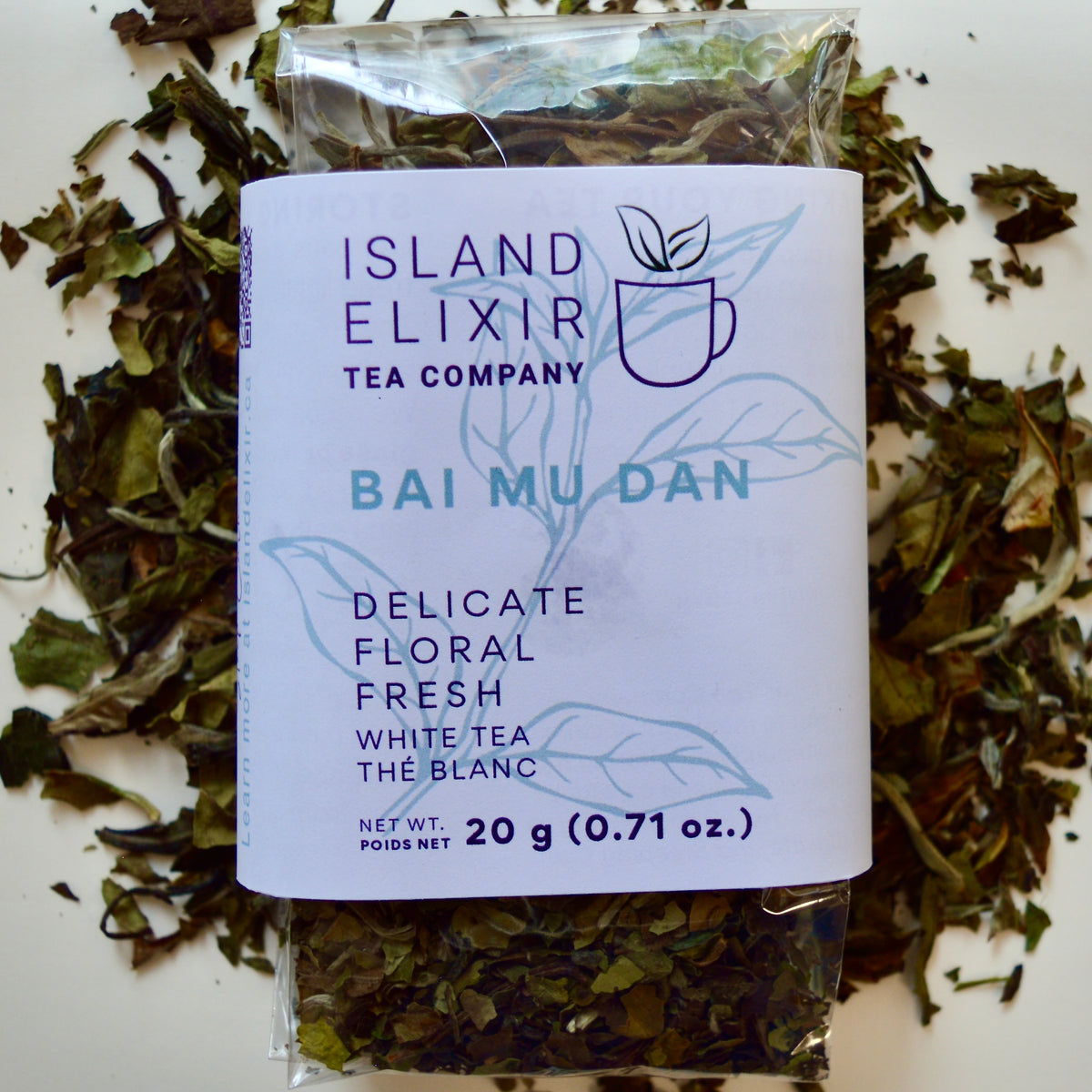 Bai Mu Dan White Tea 30 cups of tea size compostable packaging sitting on loose leaf tea that contains Chinese White Tea