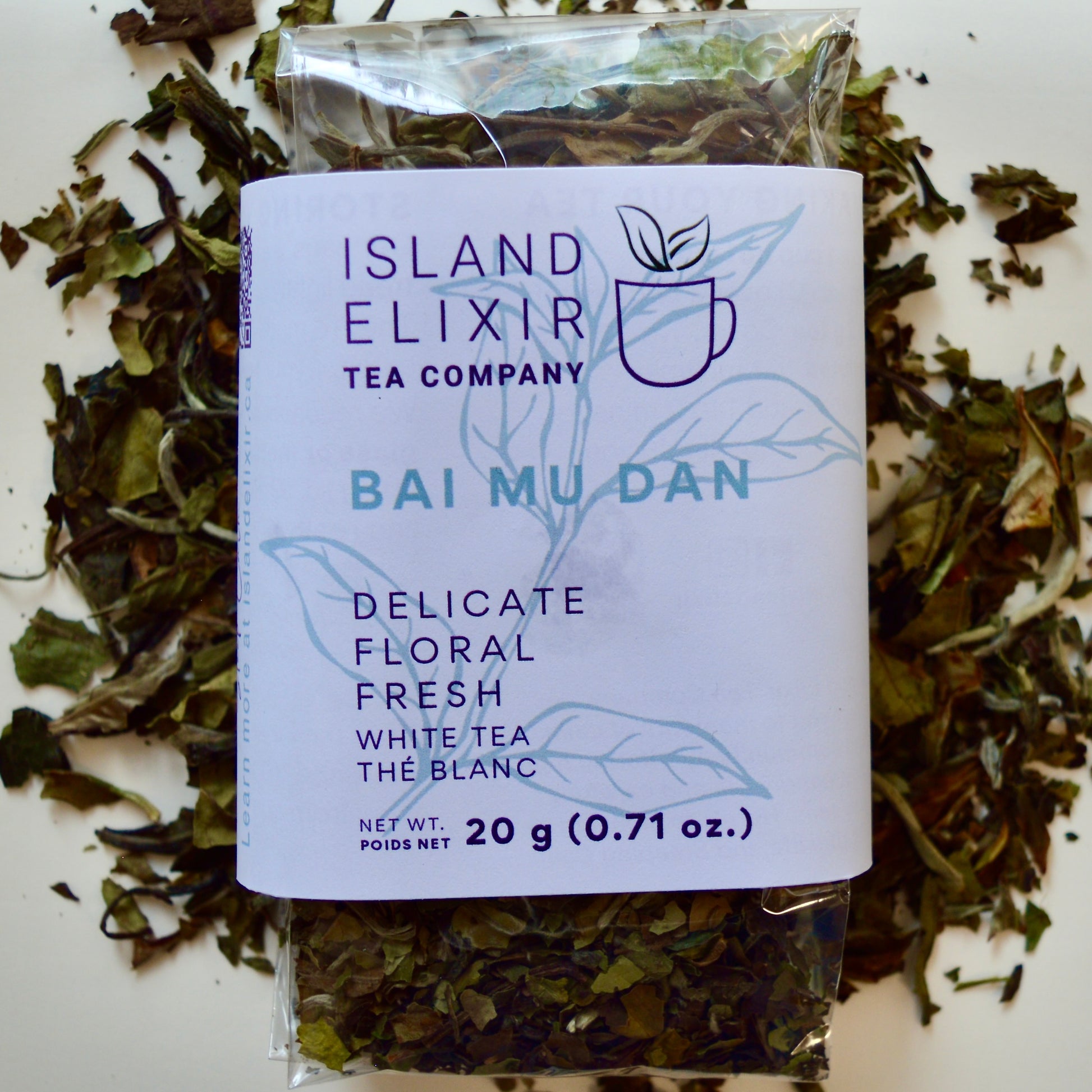 Bai Mu Dan White Tea 30 cups of tea size compostable packaging sitting on loose leaf tea that contains Chinese White Tea