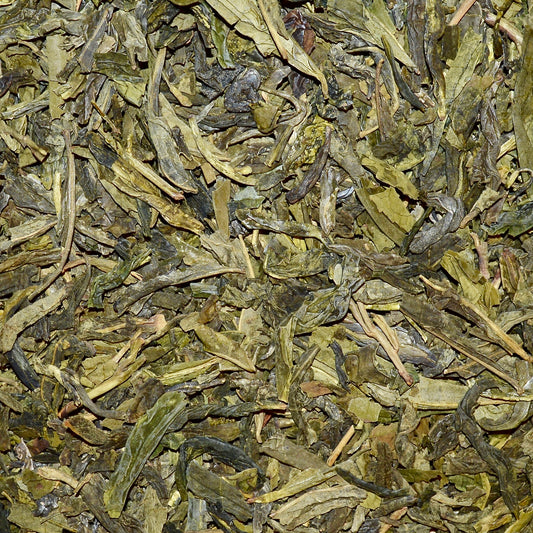 Dragonwell green tea dried loose leaf tea close up 