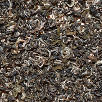 Farmers Green Dried green tea leaves close up