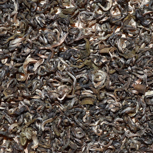 Farmers Green Dried green tea leaves close up