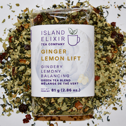 Ginger Lemon Lift Herbal Tea 30 cups of tea size compostable packaging sitting on loose leaf tea that contains Green tea*, rose hip*, eucalyptus*, lemon*, ginger*.
