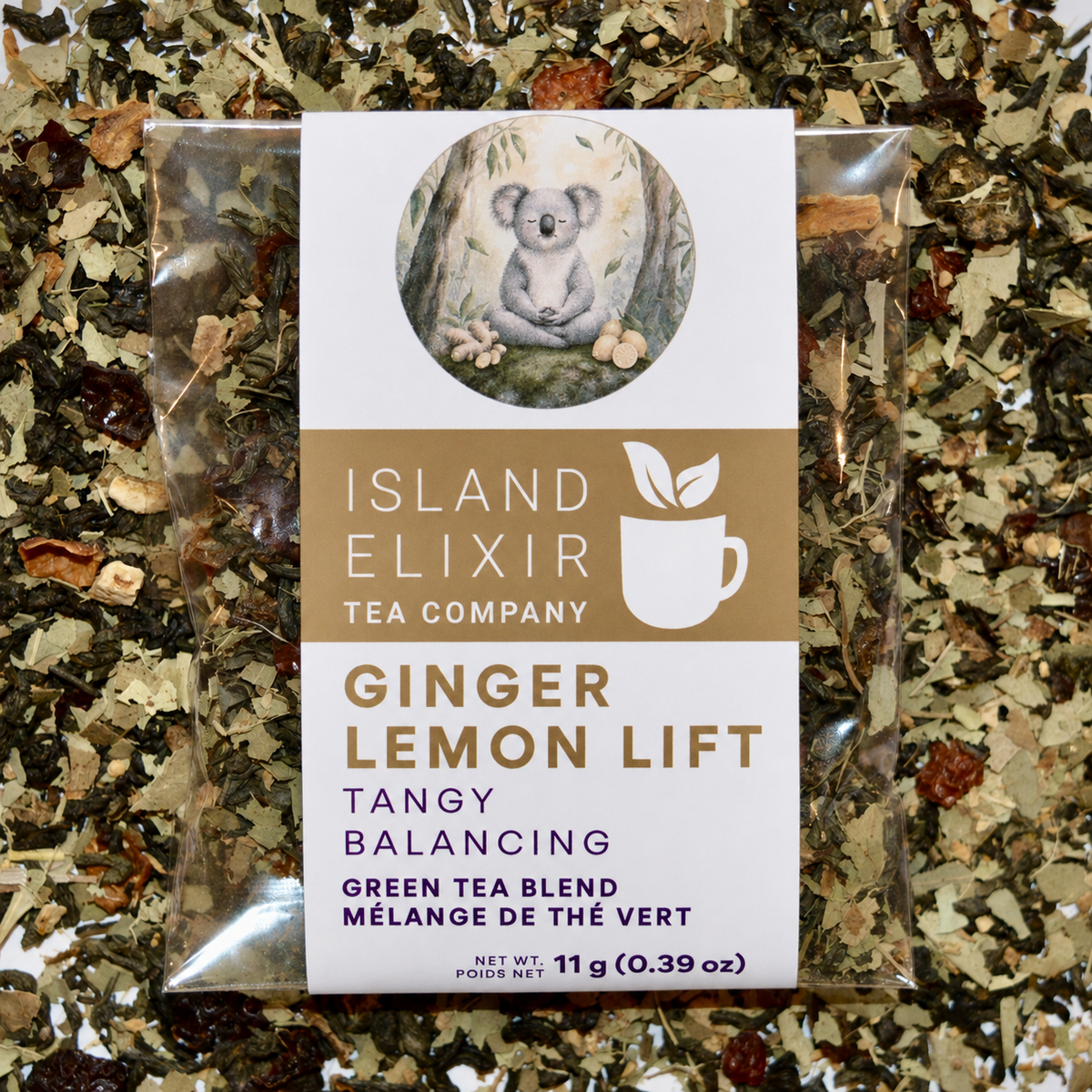 Ginger Lemon Lift Herbal Tea 4 cups of tea size compostable packaging sitting on loose leaf tea that contains Green tea*, rose hip*, eucalyptus*, lemon*, ginger*.