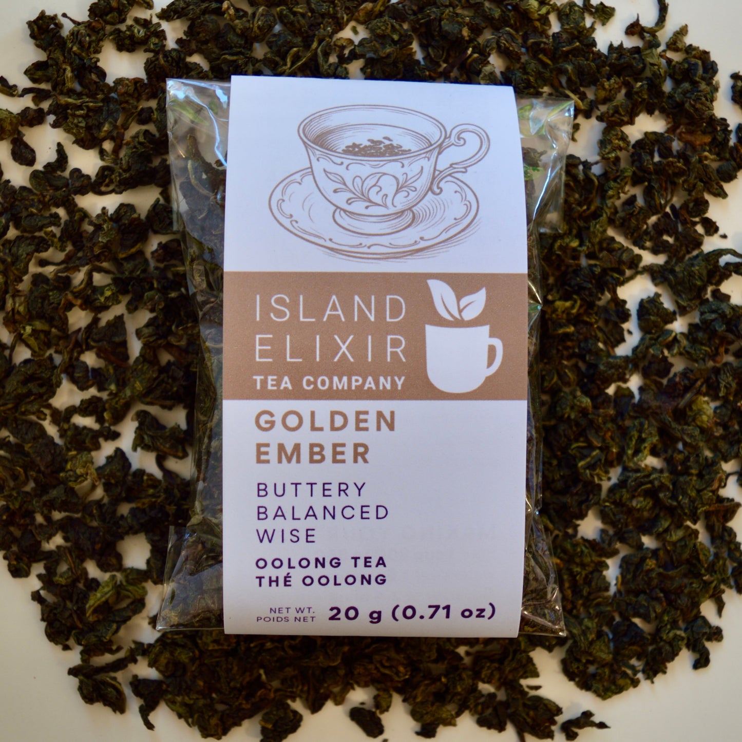 Golden Ember black Tea 10 cups of tea size compostable packaging sitting on loose leaf tea that contains Lightly oxidized oolong tea from China