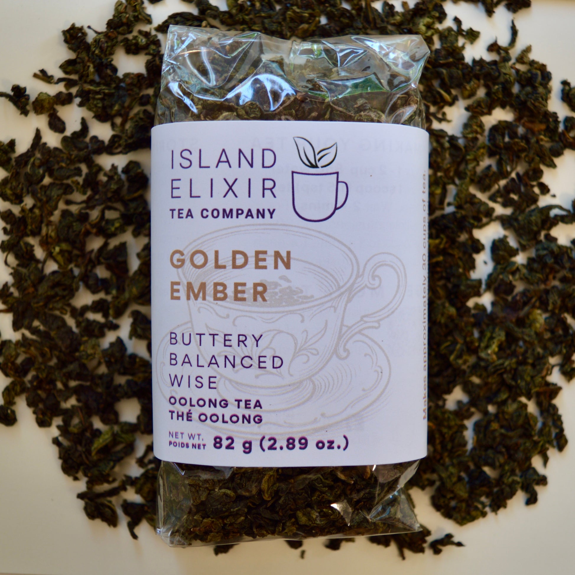 Golden Ember black Tea 30 cups of tea size compostable packaging sitting on loose leaf tea that contains Lightly oxidized oolong tea from China
