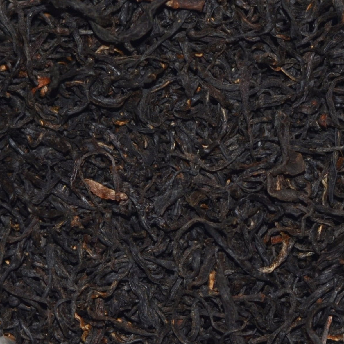 Imperial Keemun Mao Feng Black Tea. Loose tea leaves showing the fine, wiry twist and very well made Chinese black tea.