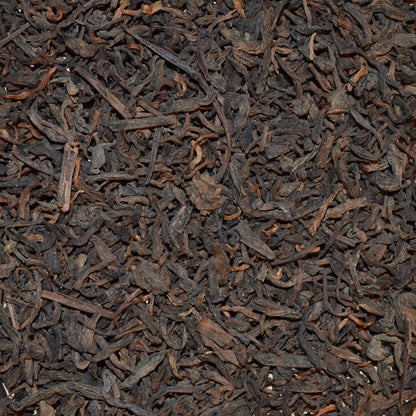 Pu'erh Junior year dried tea leaves close up rich browns and caramel colours