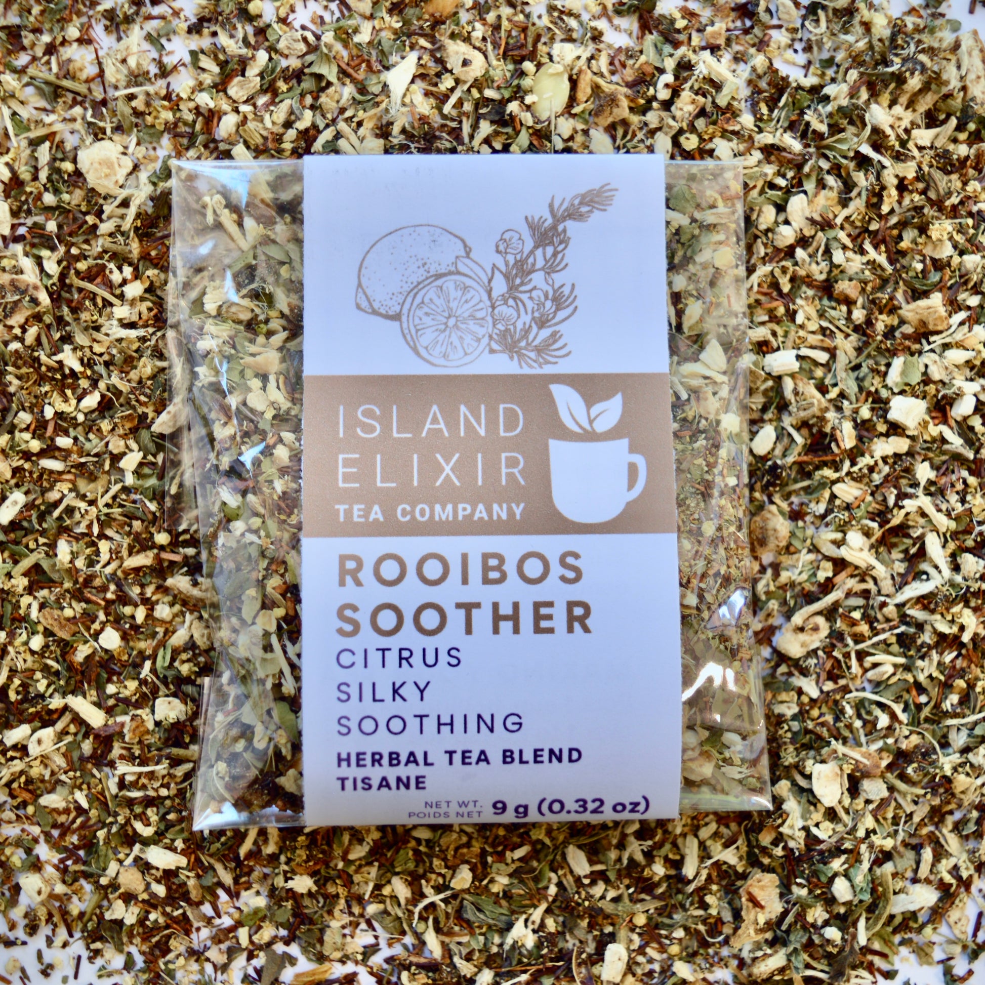 Rooibos Soother Herbal Tea 4 cups of tea size compostable packaging sitting on loose leaf tea that contains Marshmallow root, lemon, rooibos, elderflower, peppermint