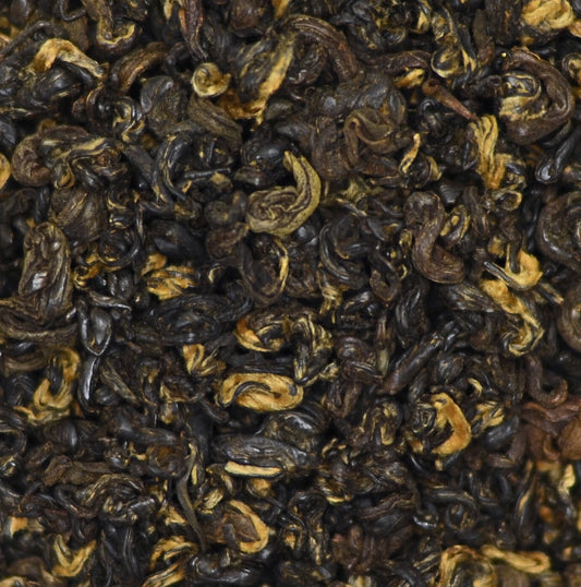 Summit Loose Leaf Tea from Nepal. Photo show incredible tightly balled tea leaves with high proportion of golden tips. Grown using organic methods in Nepal at the base of Mount Everest. A favourite of tea lovers. Suitable for Gong Fu Cha steeping. Elegant gift for tea lovers.