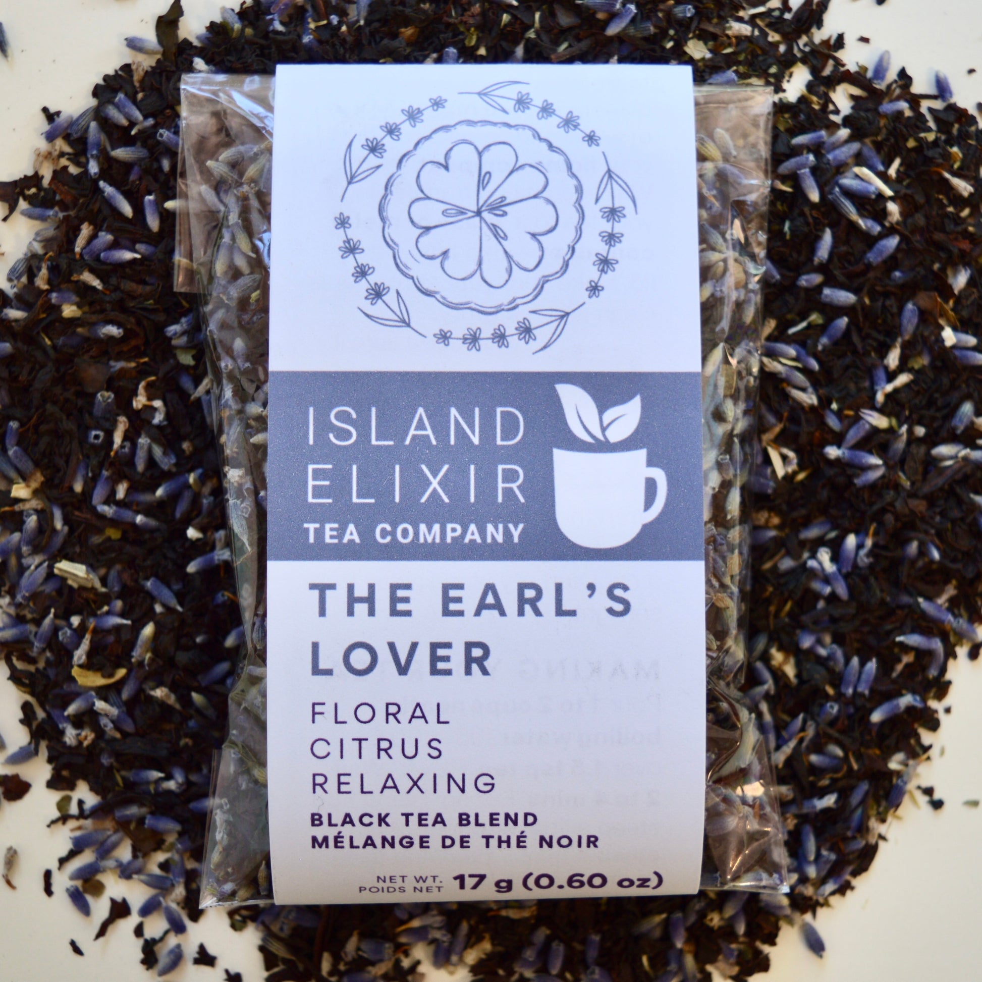 The Earl's Lover Black Tea 10 cups of tea size compostable packaging sitting on loose leaf tea that contains Black tea*, lavender**, anise hyssop*, bergamot flavour (organic compliant) 
