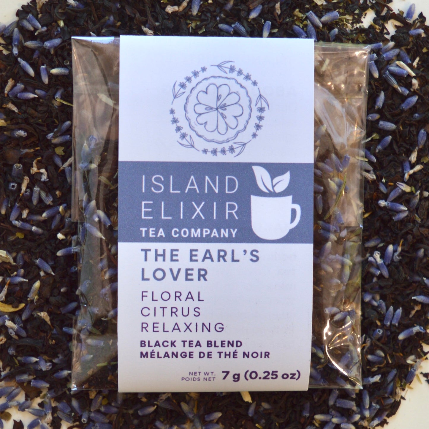 The Earl's Lover Black Tea 4 cups of tea size compostable packaging sitting on loose leaf tea that contains Black tea*, lavender**, anise hyssop*, bergamot flavour (organic compliant) 
