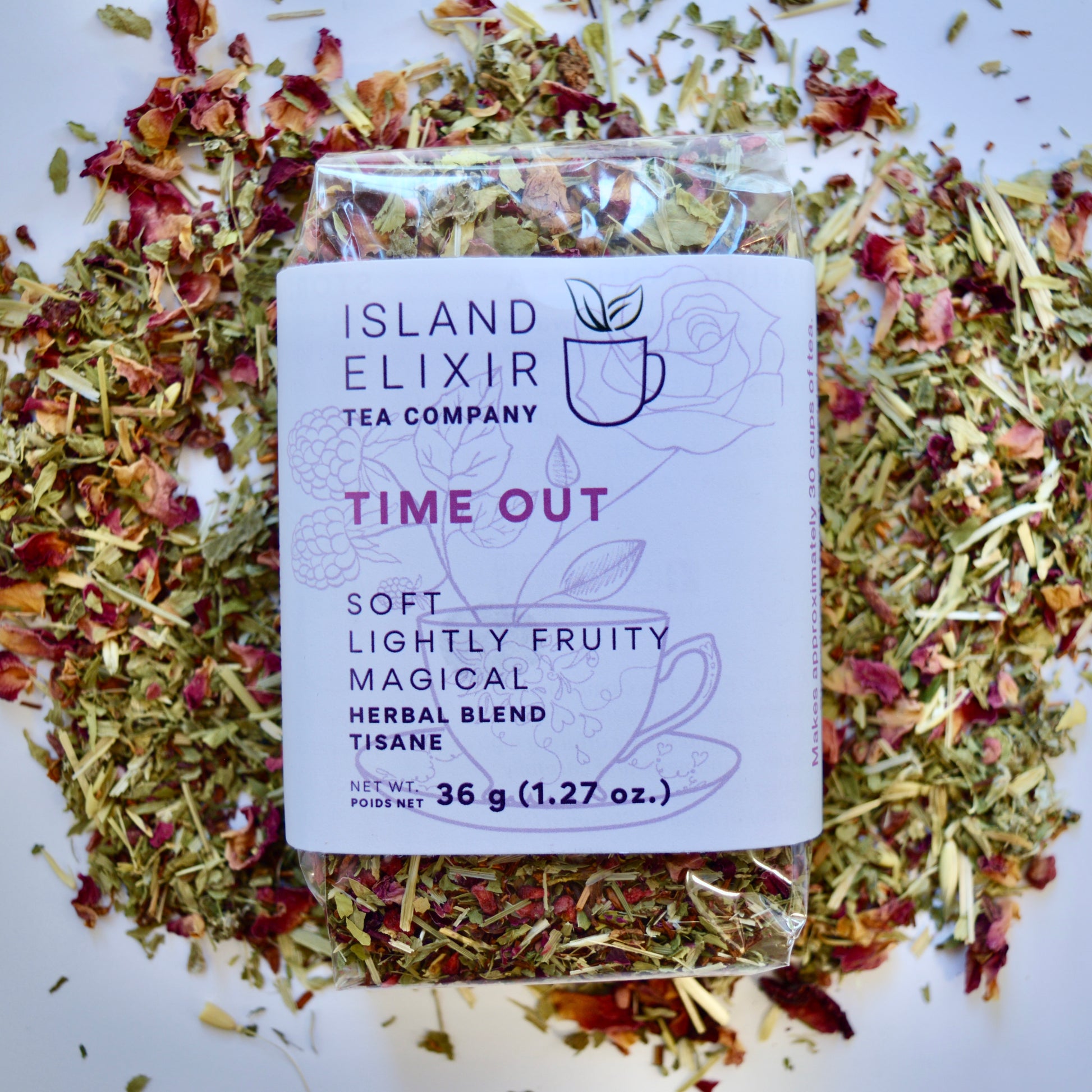 Time out Herbal Tea 30 cups of tea size compostable packaging sitting on loose leaf tea that contains Raspberry, Alfalfa, Oatstraw, Rose, Rooibos, Nettle, Red clover, Raspberry leaf