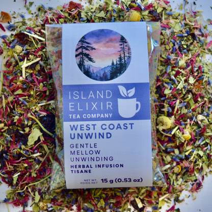 West Coast Unwind Herbal Tea 10 cups of tea size compostable packaging sitting on loose leaf tea that contains rose hip, lemon balm, lavender, marshmallow leaf, passion flower chamomile, red cornflower. 
